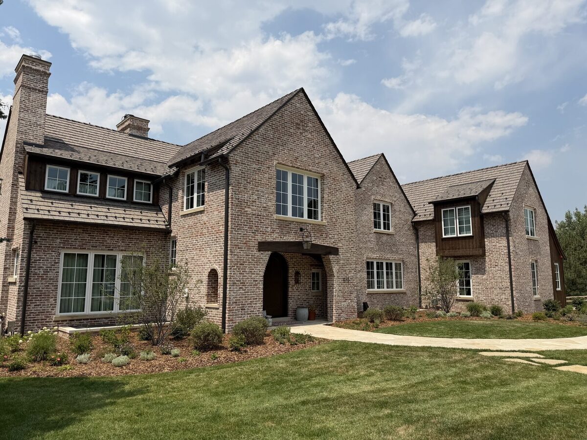 Two-story brick home with freshly cleaned windows